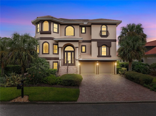 mediterranean / spanish house featuring a garage