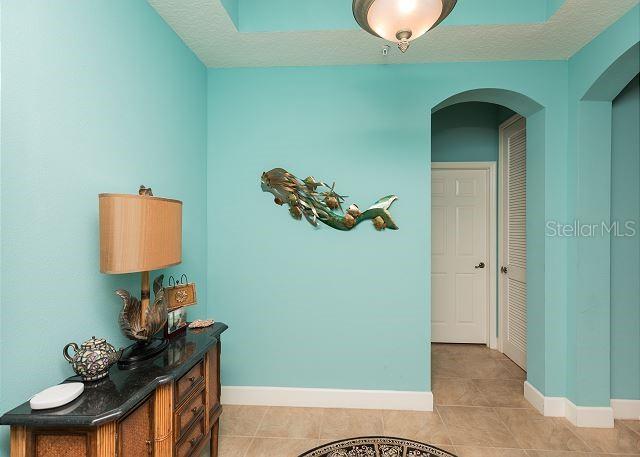 hallway with light tile floors