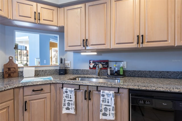 kitchen featuring light brown cabinetry, dishwashing machine, sink, and light stone countertops