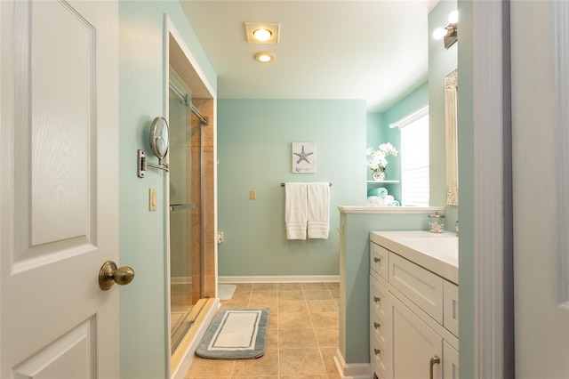 bathroom featuring vanity and a shower with shower door