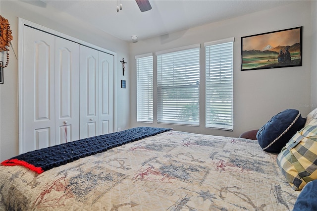 bedroom featuring ceiling fan and a closet