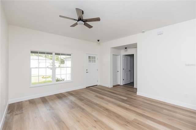 unfurnished room featuring light hardwood / wood-style floors and ceiling fan