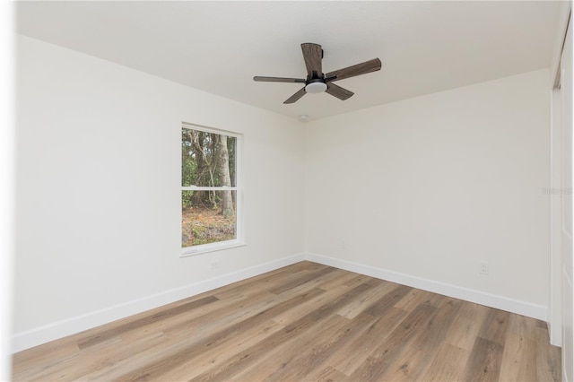 unfurnished room with ceiling fan and light hardwood / wood-style flooring