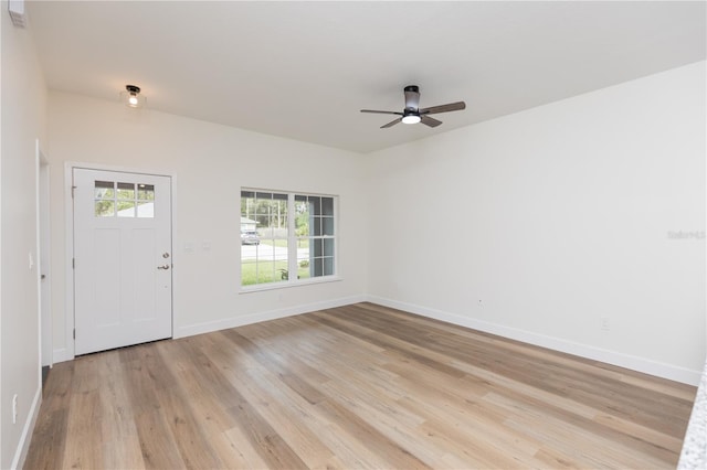 foyer with ceiling fan and light hardwood / wood-style flooring