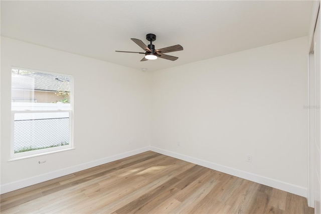 unfurnished room with ceiling fan and light hardwood / wood-style flooring