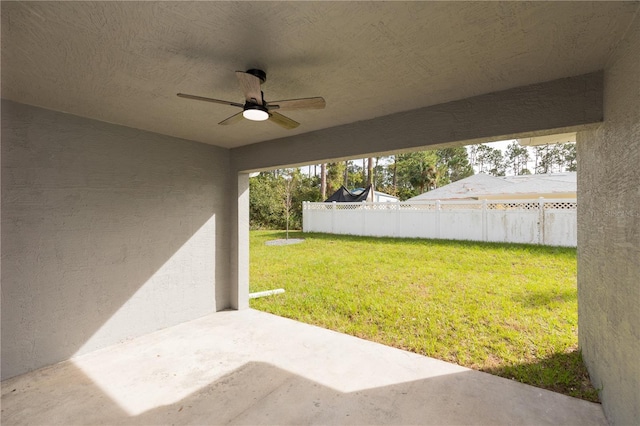 view of yard featuring ceiling fan