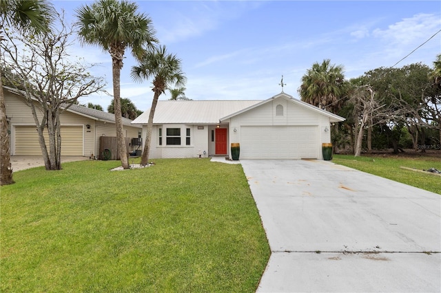 single story home featuring a front lawn and a garage