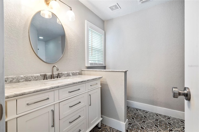 bathroom with oversized vanity and tile flooring