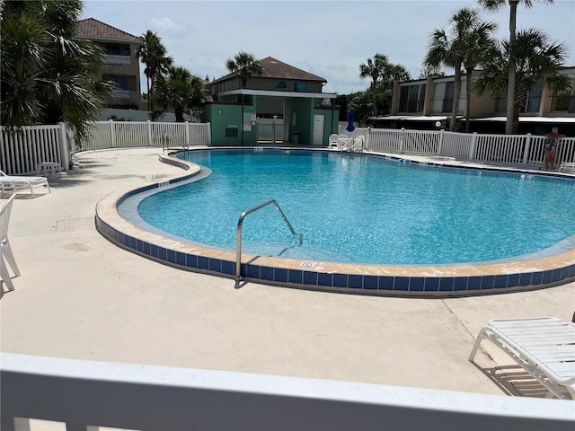 view of swimming pool with a patio area