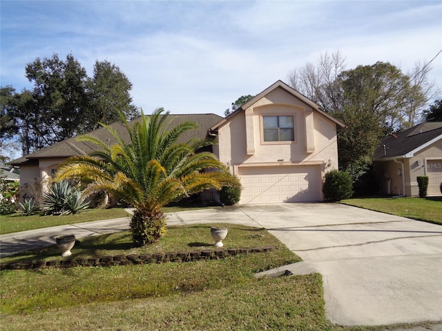 view of front of house featuring a front yard and a garage