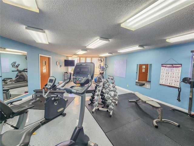 workout area featuring a textured ceiling