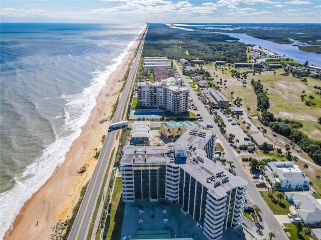 bird's eye view with a beach view and a water view