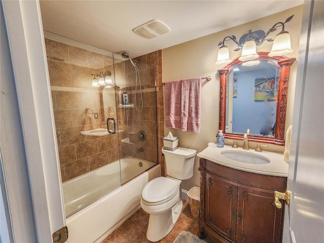 full bathroom featuring enclosed tub / shower combo, toilet, tile flooring, and vanity