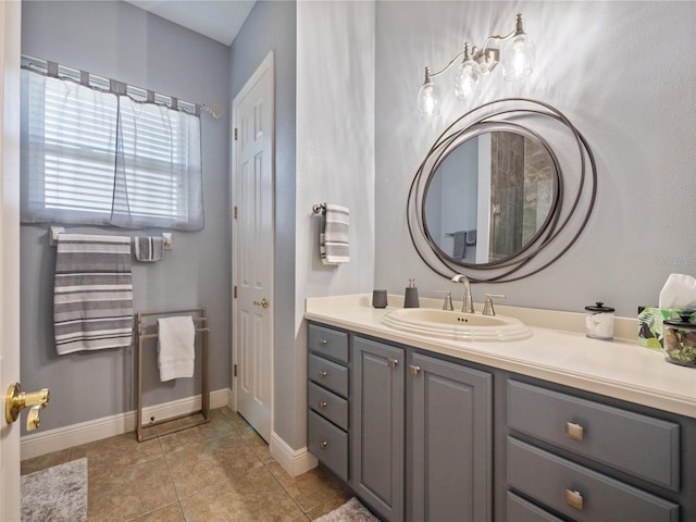 bathroom with tile floors and vanity