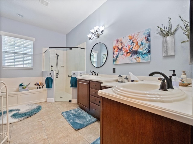 bathroom featuring double vanity, tile flooring, and separate shower and tub