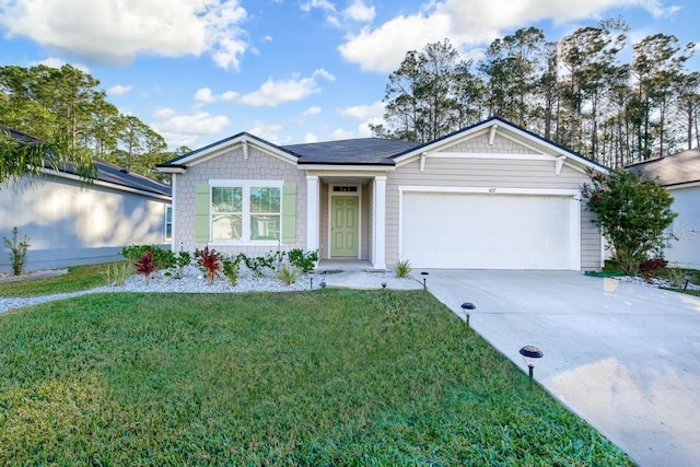 ranch-style home with solar panels, a front yard, and a garage