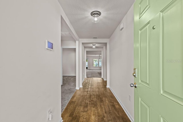 corridor with dark wood-type flooring