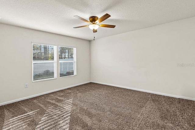 spare room with carpet and ceiling fan