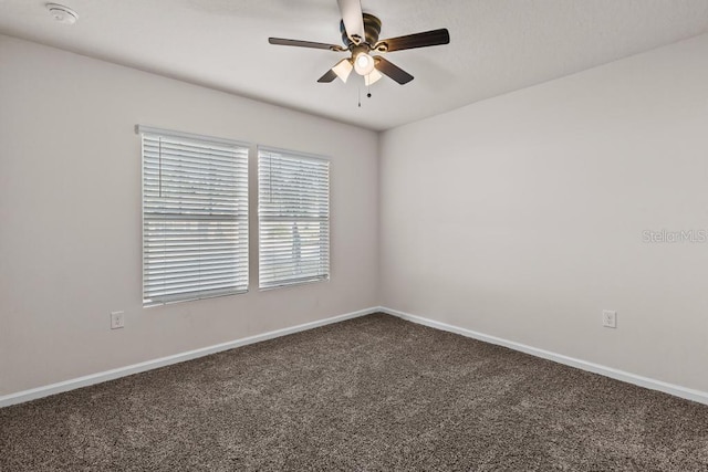 spare room with carpet flooring and ceiling fan