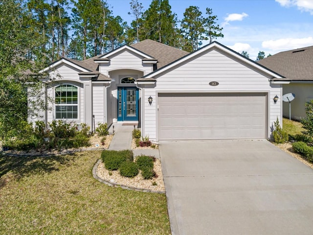 single story home with a front lawn and a garage