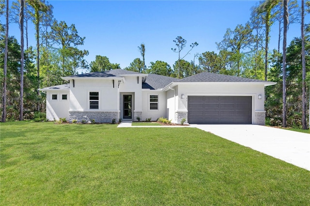 view of front facade featuring a front yard and a garage