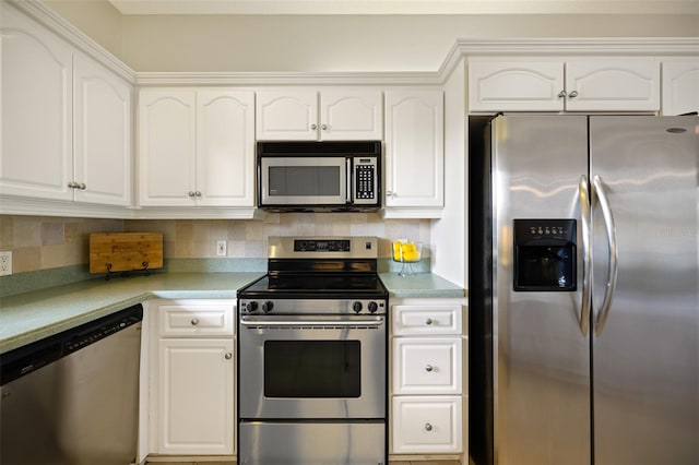 kitchen featuring backsplash, white cabinetry, and appliances with stainless steel finishes