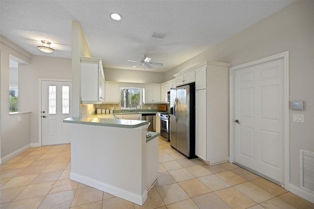 kitchen featuring backsplash, ceiling fan, and light tile floors