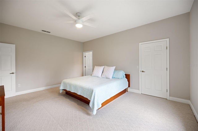 bedroom featuring light colored carpet and ceiling fan