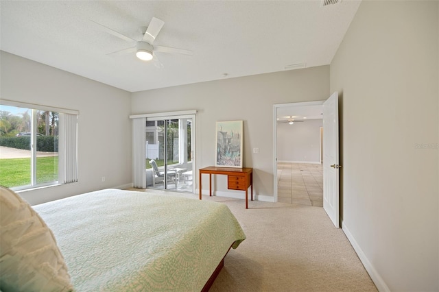 bedroom with light carpet, ceiling fan, and access to outside