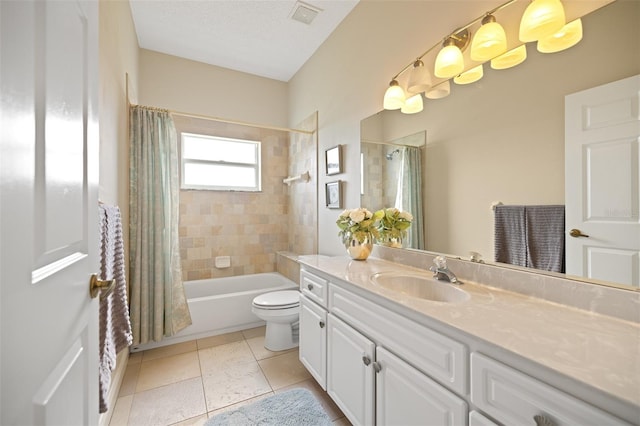 full bathroom featuring toilet, tile floors, shower / tub combo with curtain, a textured ceiling, and vanity