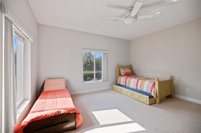 bedroom with light colored carpet and ceiling fan