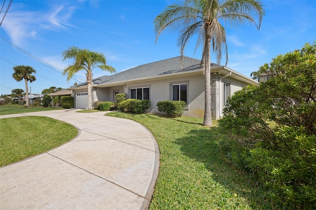 single story home with a front lawn and a garage