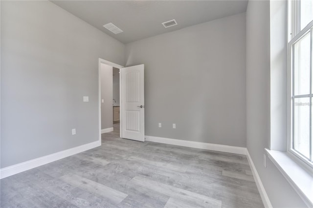 unfurnished room featuring light wood-type flooring