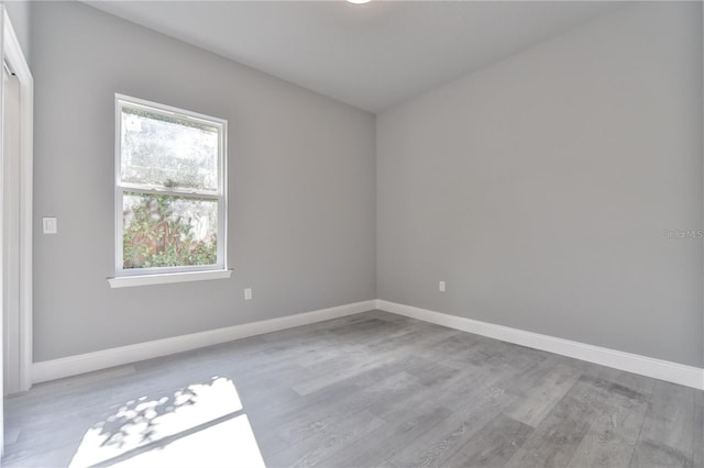 spare room featuring light wood-type flooring