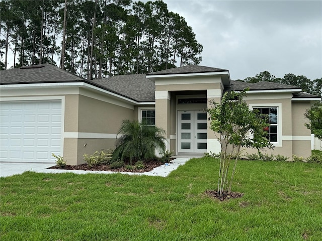 prairie-style home with a garage and a front lawn