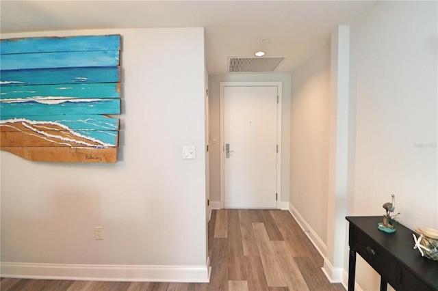 corridor featuring light hardwood / wood-style flooring