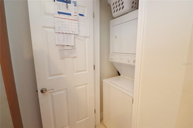 laundry room featuring stacked washing maching and dryer