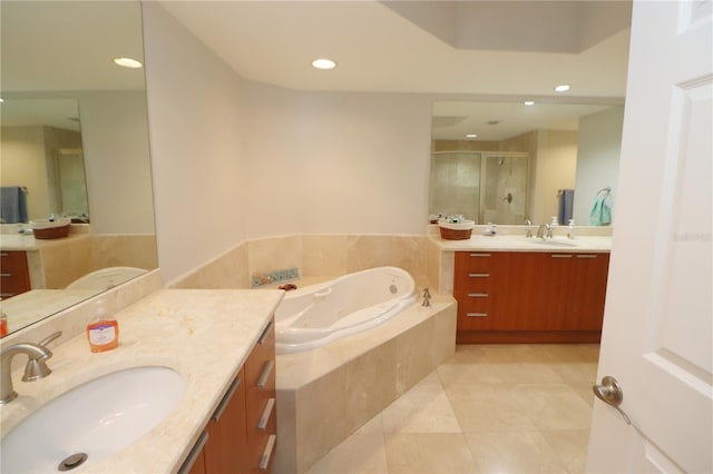 bathroom featuring independent shower and bath, tile floors, and double vanity