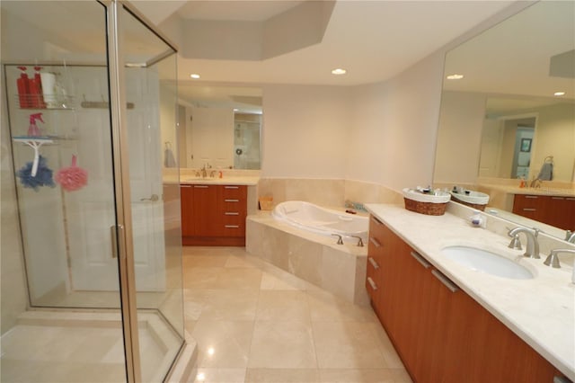 bathroom featuring vanity, independent shower and bath, and tile flooring