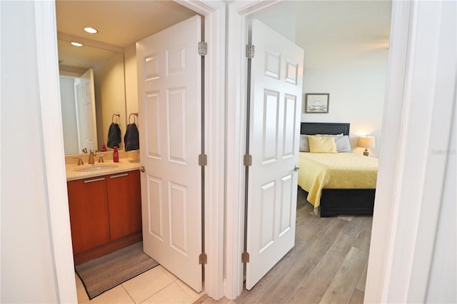 interior space with sink and light tile flooring