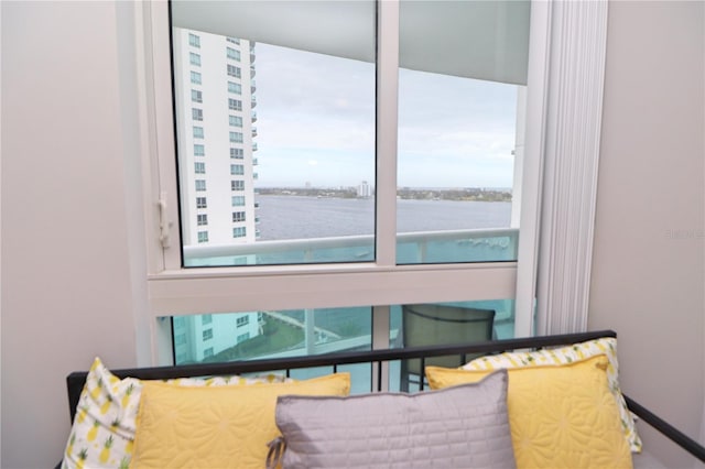 bedroom featuring a water view