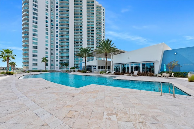 view of swimming pool with a patio area