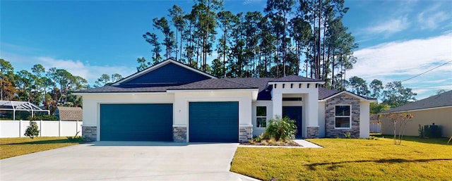 view of front of home featuring a front lawn and a garage