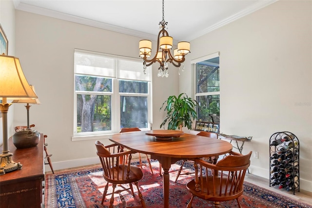 dining space featuring a chandelier, crown molding, and hardwood / wood-style flooring