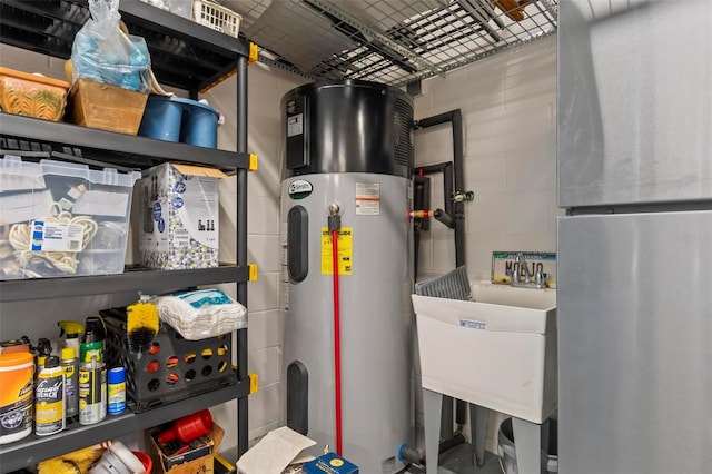 utility room featuring hybrid water heater