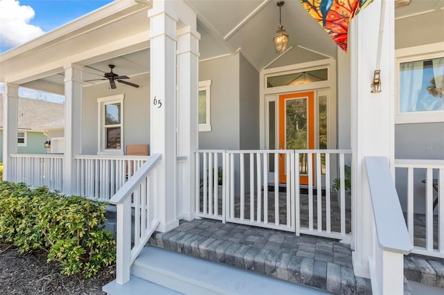 doorway to property featuring covered porch and ceiling fan