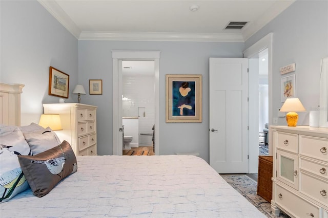 bedroom with connected bathroom and ornamental molding