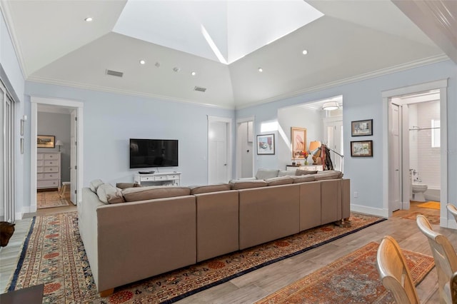 living room with vaulted ceiling and light wood-type flooring