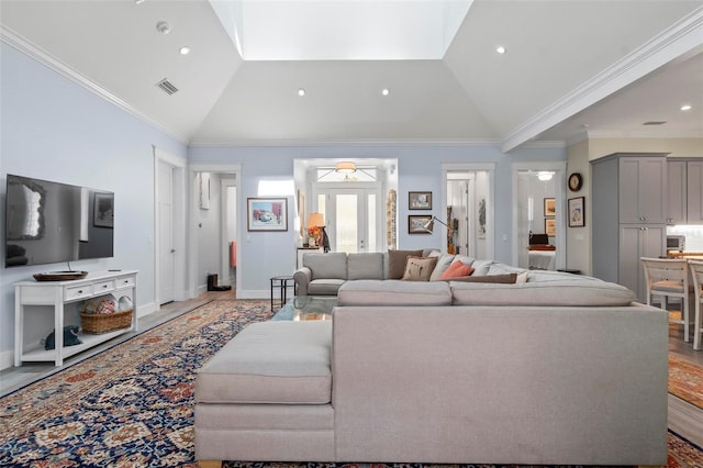 living room with high vaulted ceiling, light hardwood / wood-style floors, and ornamental molding