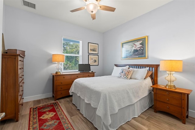 bedroom with ceiling fan and light wood-type flooring